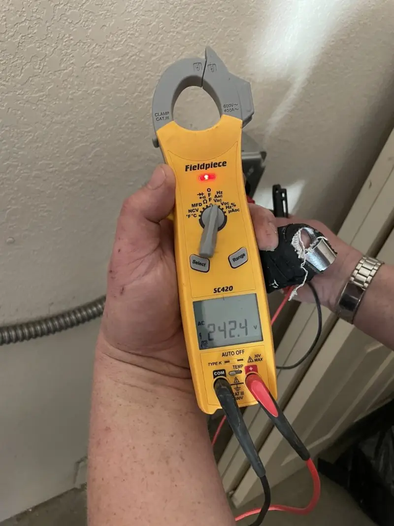Voltage testing with clamp meter during Generator Installation in Genoa